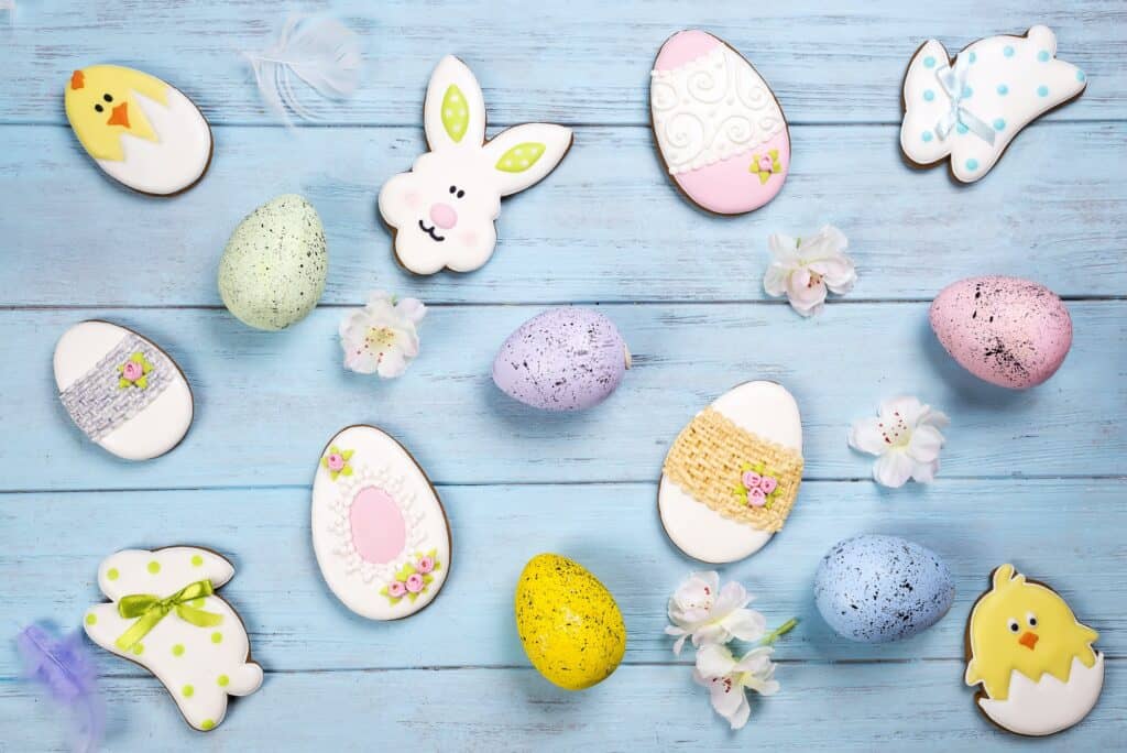 Easter background. Cookies in shape of Easter eggs and Easter bunny.